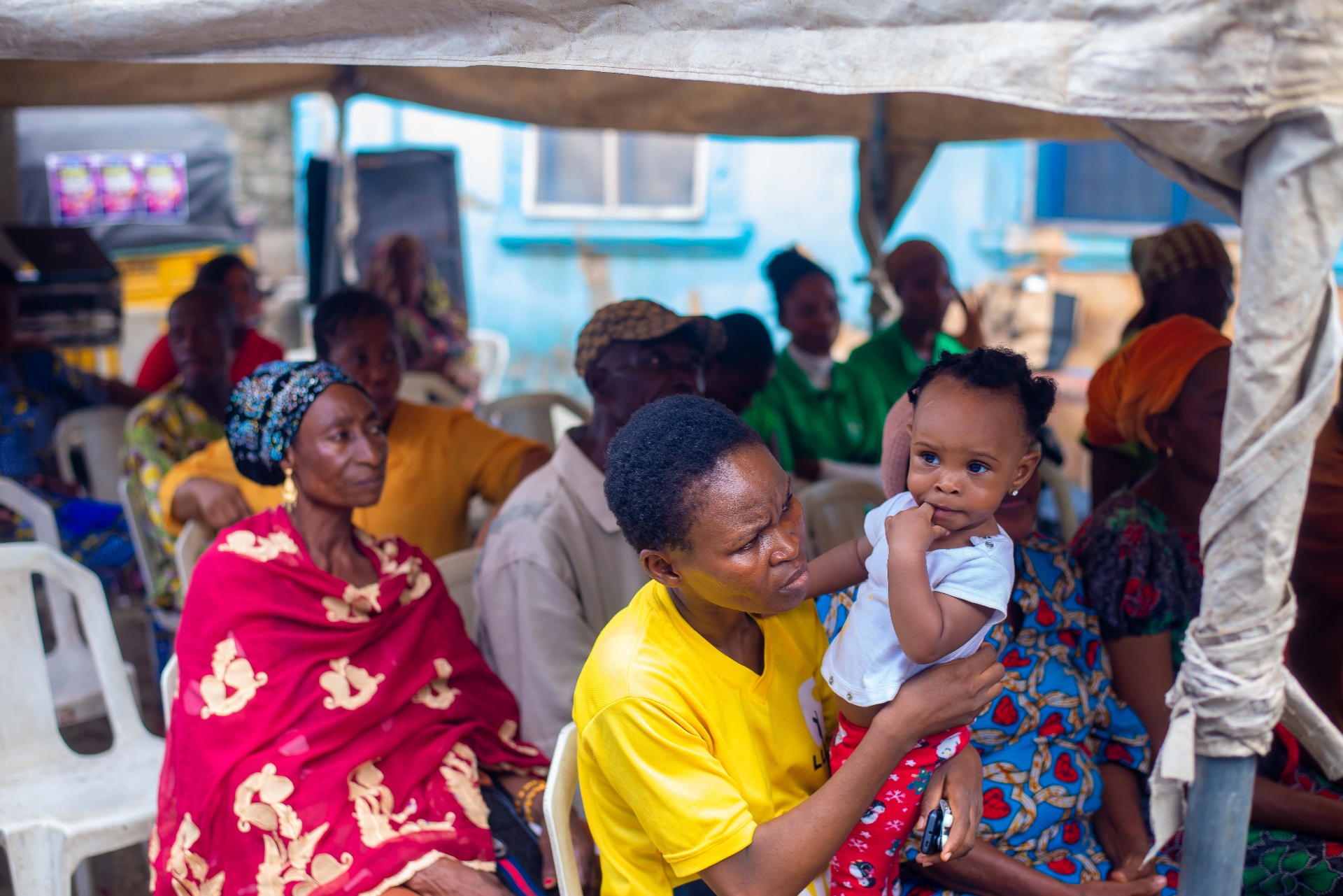 Mother and child waiting at MSCF outreach tent